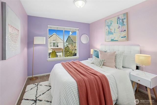 bedroom with carpet floors and baseboards