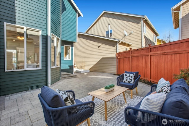 view of patio / terrace with outdoor lounge area and fence