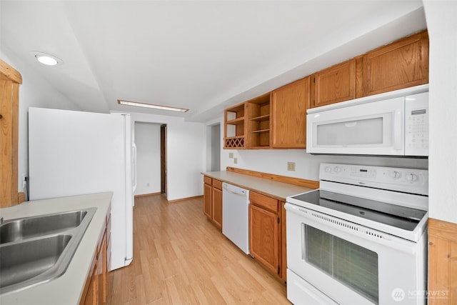 kitchen with white appliances, brown cabinets, light countertops, light wood-type flooring, and open shelves