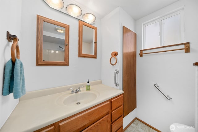 bathroom featuring toilet and vanity