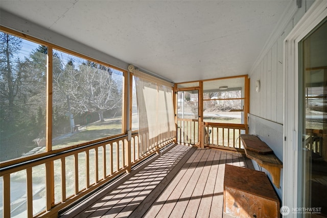 unfurnished sunroom featuring a wealth of natural light