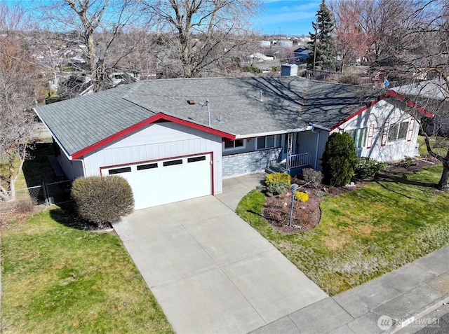 single story home with driveway, fence, an attached garage, a shingled roof, and a front yard