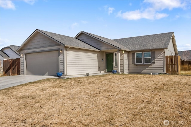 single story home with a shingled roof, concrete driveway, a front yard, fence, and a garage