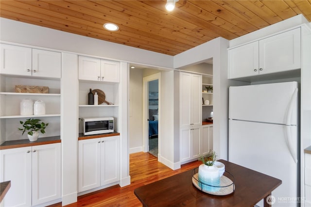 kitchen with white appliances, open shelves, light wood-style flooring, white cabinets, and wooden ceiling