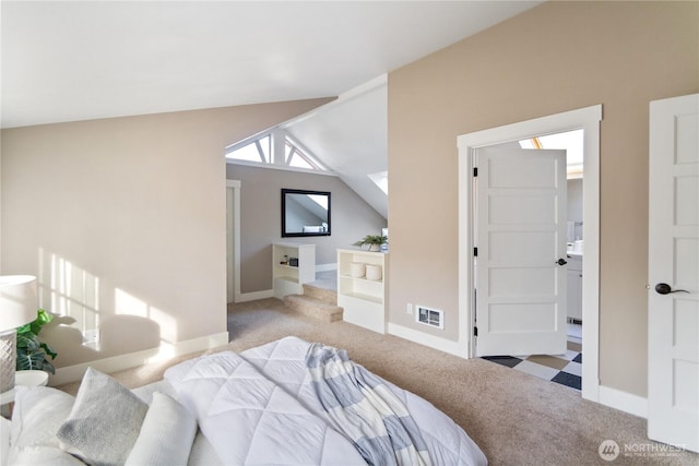 carpeted bedroom featuring visible vents, baseboards, and vaulted ceiling