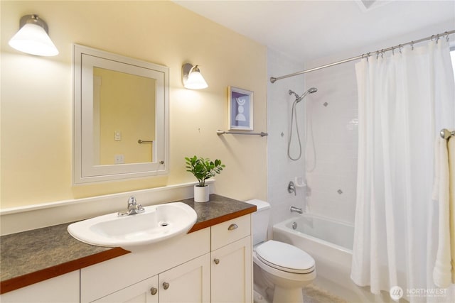 bathroom featuring vanity, toilet, and shower / tub combo with curtain