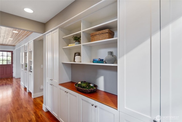 corridor featuring wood finished floors