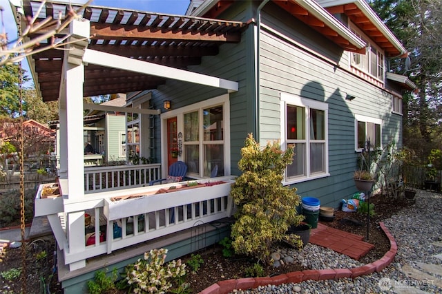 view of side of property featuring a pergola