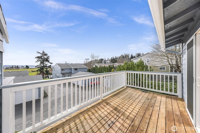 wooden terrace with a residential view