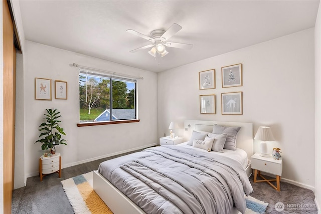 carpeted bedroom with a ceiling fan and baseboards