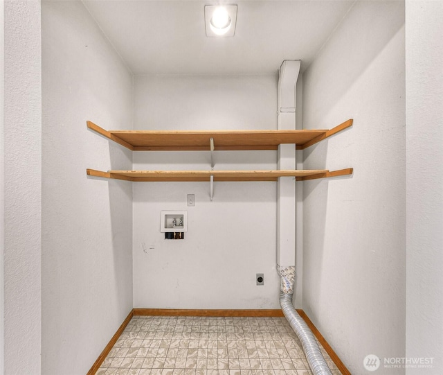 washroom featuring baseboards, hookup for an electric dryer, hookup for a washing machine, and laundry area