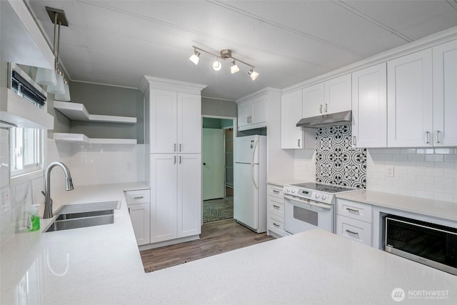 kitchen with open shelves, under cabinet range hood, a sink, white appliances, and white cabinets