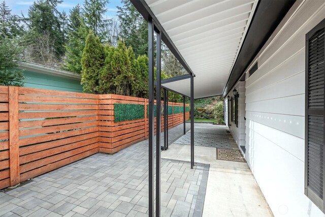 view of patio featuring fence