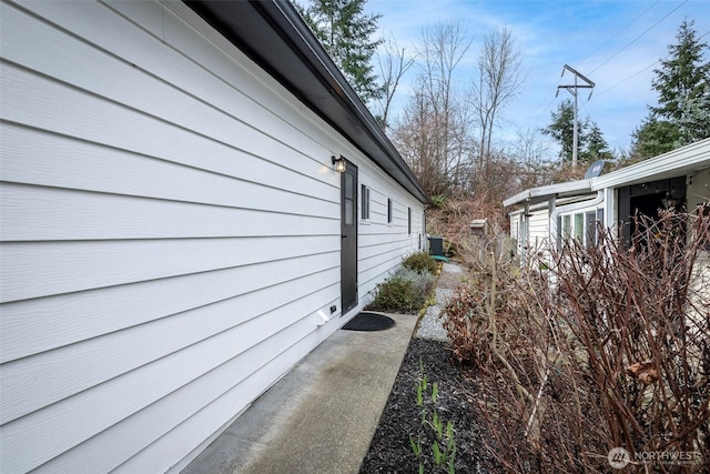 view of side of property with cooling unit