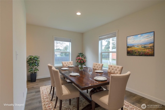 dining area with recessed lighting, baseboards, a wealth of natural light, and wood finished floors