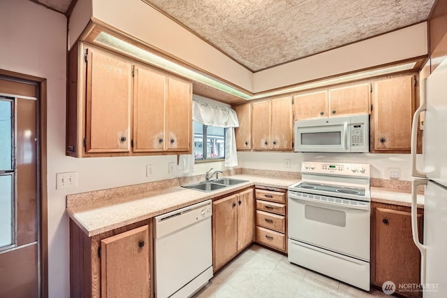 3222 S 183rd St, Seatac, WA 98188 - kitchen featuring white appliances, light countertops, and a sink