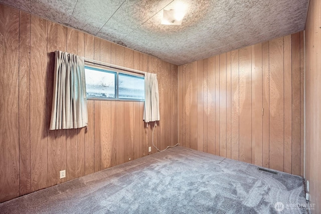 3222 S 183rd St, Seatac, WA 98188 - carpeted empty room featuring wood walls and visible vents