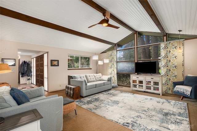 carpeted living area featuring vaulted ceiling with beams and a ceiling fan