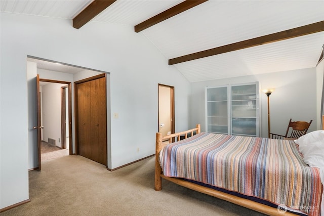 bedroom with carpet, lofted ceiling with beams, and baseboards