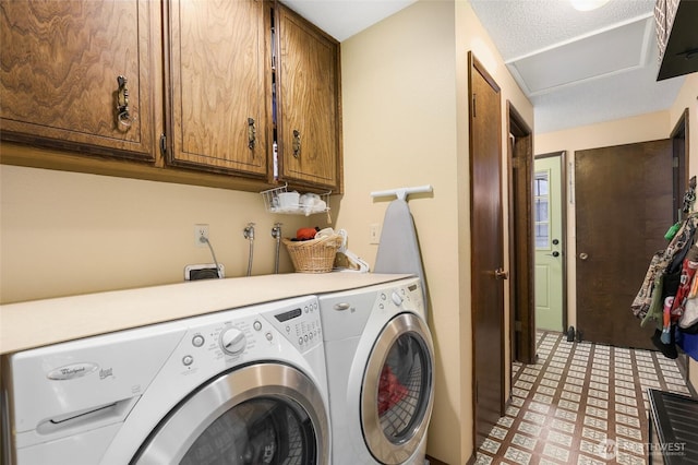 laundry area featuring cabinet space, light floors, and independent washer and dryer