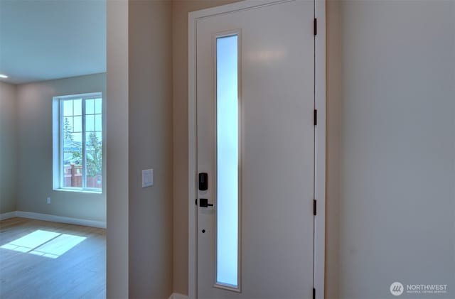 20907 150th St E Unit 1460, Bonney Lake, WA 98391 - entryway with baseboards and light wood finished floors