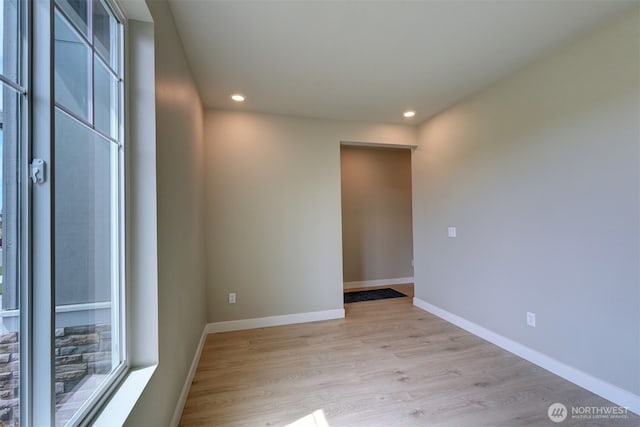 20907 150th St E Unit 1460, Bonney Lake, WA 98391 - spare room featuring recessed lighting, light wood-style flooring, and baseboards