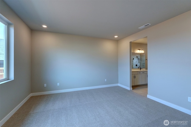 20907 150th St E Unit 1460, Bonney Lake, WA 98391 - empty room with recessed lighting, visible vents, light carpet, plenty of natural light, and baseboards