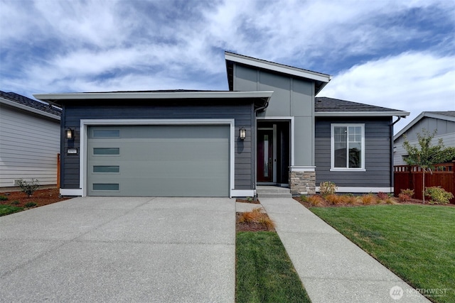 20907 150th St E Unit 1460, Bonney Lake, WA 98391 - view of front of property with a garage, concrete driveway, a front lawn, and fence