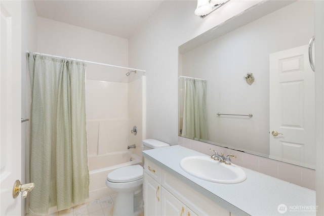 bathroom with vanity, shower / bath combo with shower curtain, and toilet