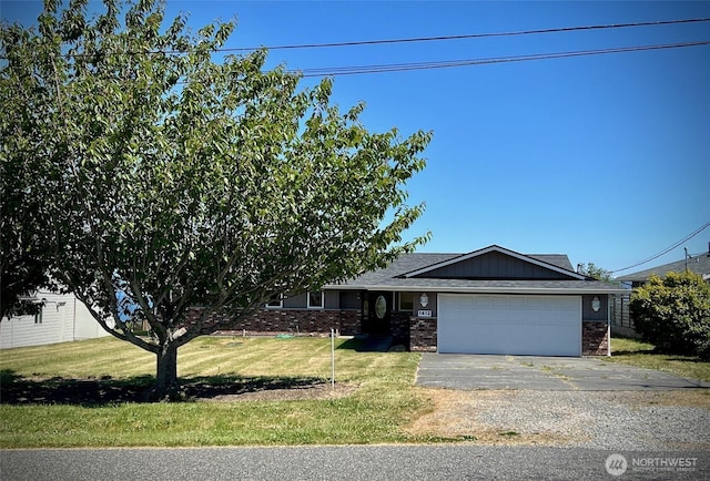 1412 Bonnie View Acres Rd, Oak Harbor, WA 98277 - ranch-style house featuring a garage, a front yard, driveway, and brick siding