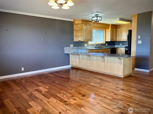 1412 Bonnie View Acres Rd, Oak Harbor, WA 98277 - kitchen featuring dishwasher, a peninsula, hardwood / wood-style flooring, ornamental molding, and a sink