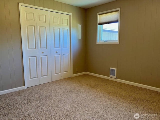 1412 Bonnie View Acres Rd, Oak Harbor, WA 98277 - unfurnished bedroom featuring carpet, a closet, and baseboards