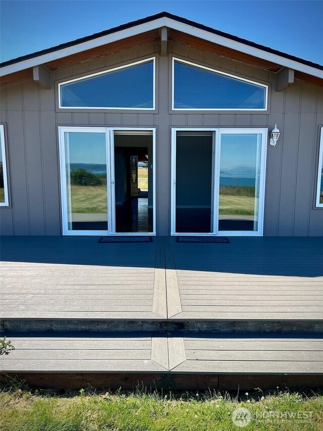 1412 Bonnie View Acres Rd, Oak Harbor, WA 98277 - view of side of property with a wooden deck and board and batten siding