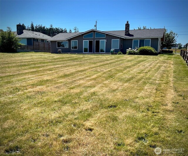 1412 Bonnie View Acres Rd, Oak Harbor, WA 98277 - back of property with a chimney
