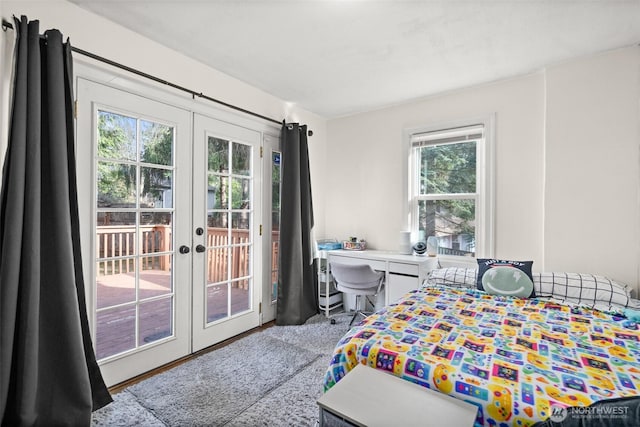 carpeted bedroom with access to outside and french doors