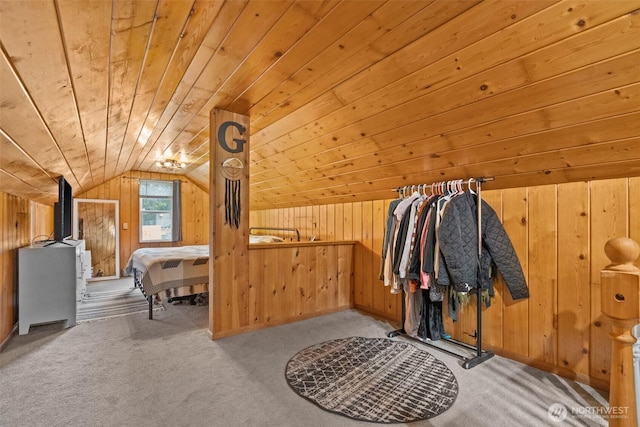 interior space featuring lofted ceiling, wood ceiling, wooden walls, and carpet flooring