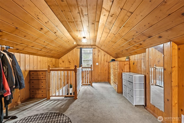 additional living space with wood ceiling, carpet flooring, vaulted ceiling, and wooden walls