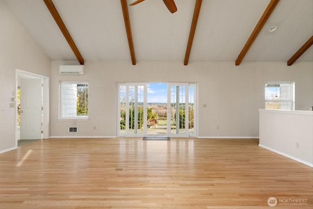 unfurnished living room with vaulted ceiling with beams, light wood finished floors, visible vents, a wall mounted AC, and a ceiling fan