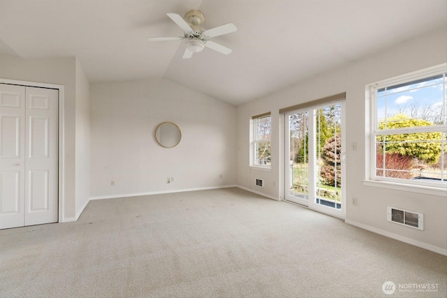 interior space featuring a healthy amount of sunlight, carpet floors, and visible vents