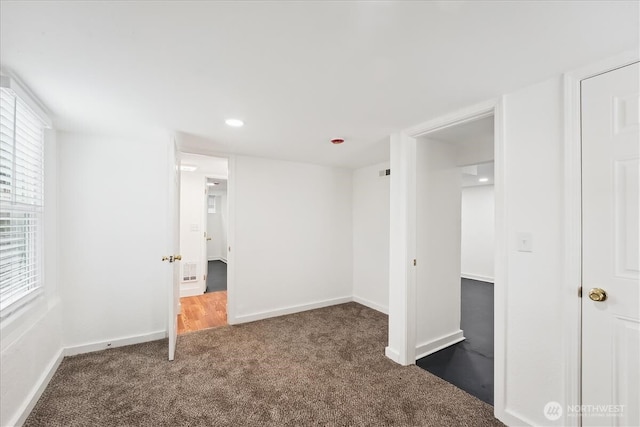 unfurnished bedroom with carpet floors, recessed lighting, and baseboards