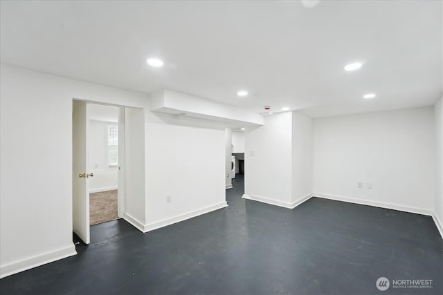 basement featuring baseboards and recessed lighting