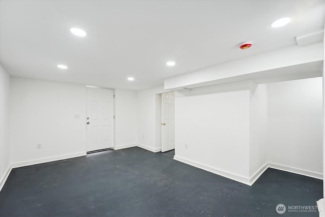 finished basement featuring baseboards and recessed lighting