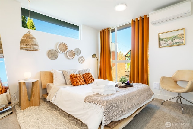 bedroom with floor to ceiling windows, a wall mounted air conditioner, baseboards, and carpet flooring