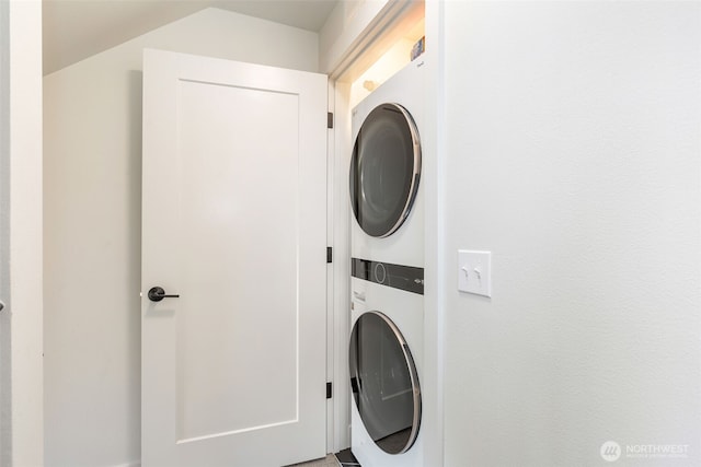 laundry area featuring laundry area and stacked washer / dryer