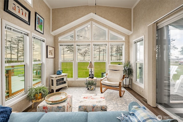 sunroom featuring lofted ceiling