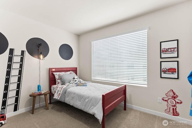 bedroom with carpet and baseboards