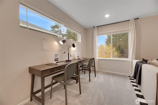 office with a healthy amount of sunlight, recessed lighting, baseboards, and light colored carpet