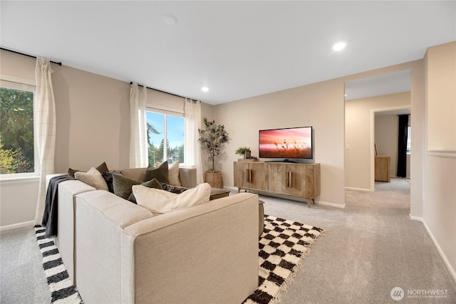 living room with light carpet, baseboards, and recessed lighting