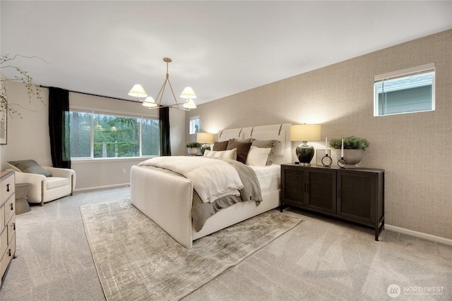 bedroom with baseboards, light carpet, wallpapered walls, and an inviting chandelier