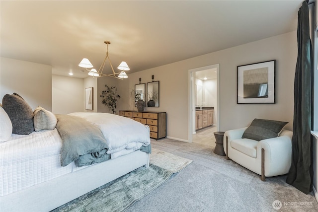 bedroom with light carpet, baseboards, connected bathroom, and a notable chandelier